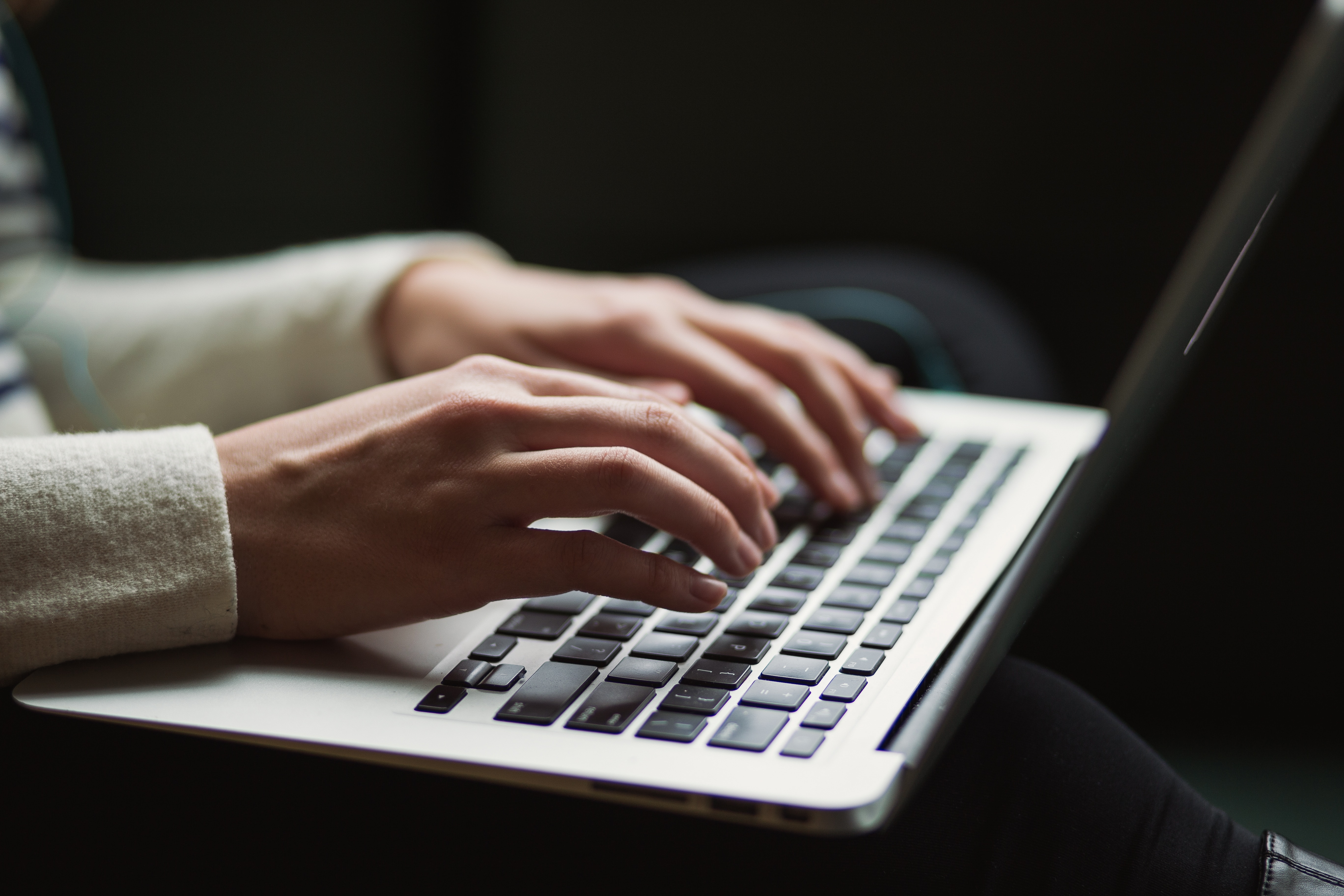 someone typing on a computer keyboard